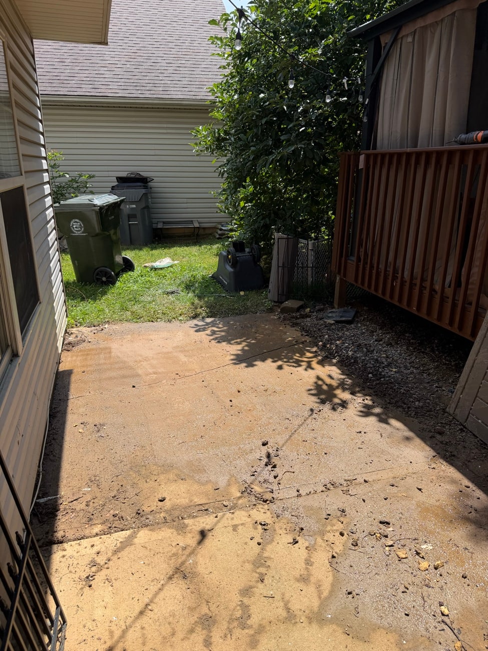 A concrete pad cleared of lumber and debris and swept clean after a haul off.